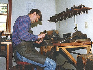 Peter Erickson forging a spoon